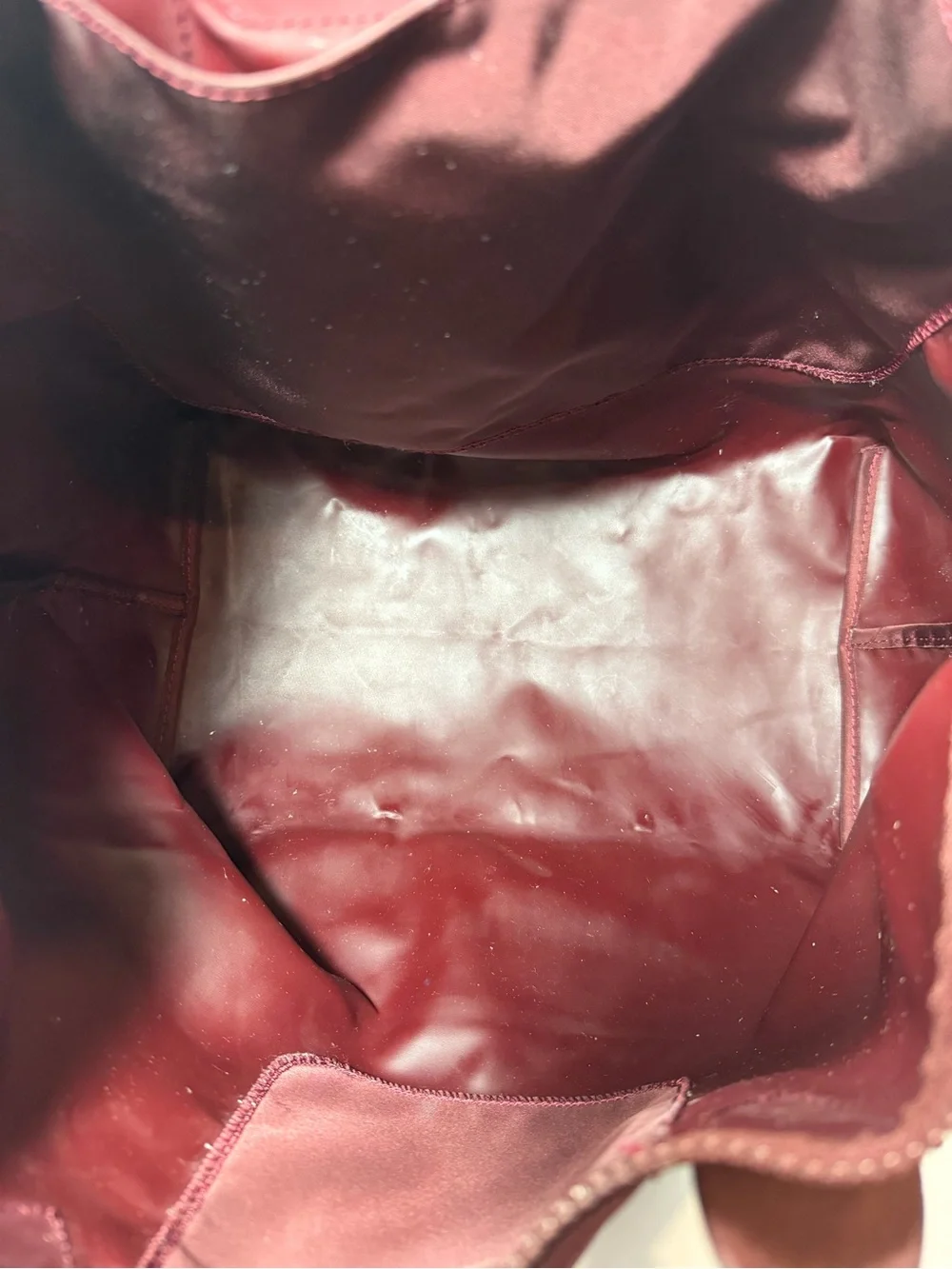 LONGCHAMP Burgundy medium Le Pliage tote from LONGCHAMP featuring leather trim